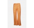 	women's elastic orange bell bottoms with geometric patterns	
